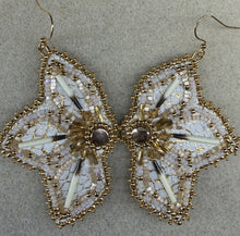 Load image into Gallery viewer, White and metallic gold floral fish skin earrings with porcupine quills. With gold &amp; sheen charlotte cut beads, satin beads, gold bugles, Swarovski crystals. Backed w/ mooseskin and hung on gold hooks.