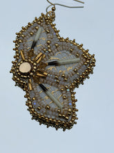 Load image into Gallery viewer, White and metallic gold floral fish skin earrings with porcupine quills. With gold &amp; sheen charlotte cut beads, satin beads, gold bugles, Swarovski crystals. Backed w/ mooseskin and hung on gold hooks.