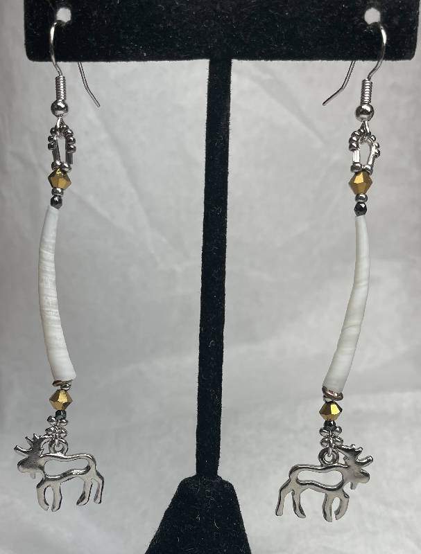Dentalium earrings w/silver moose charms. Embellished w/silver plated beads, hematite and Japanese crystals. On surgical steel hooks