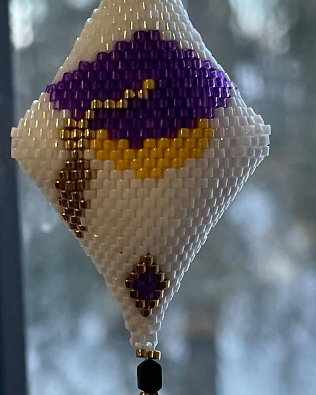 Graduation peyote pod 2 sided in purple and yellow with gold tassel.