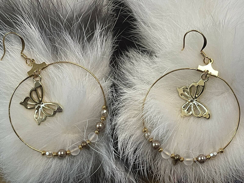 Gold butterfly hoop earrings w/24k seed beads, 4 mm bronze pearls, 4 mm matte crystal quartz, 3 mm cream pearl beads and bronze mini daggers. On gold filled hooks.