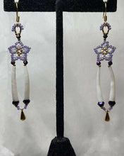 Load image into Gallery viewer, 24k gold purple and white Charlotte cut Size 15 stars with 2 sizes of crystals, smooth dentalium, gold teardrop ornament hung on 24k gold filled hooks. Measures 3” top to bottom