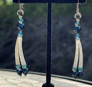 Dentalium earrings w/Blue pearl hearts, medium blue Australian crystals, size 15 and 11 sterling silver beads. On hypoallergenic hooks.