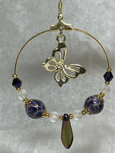 Load image into Gallery viewer, Gold butterfly hoop earring with purple and gold cloisonné round beads and gold bead caps, matte crystal quartz, Australian crystals, purple iris daggers and 24k gold seed beads. On gold filled hooks.