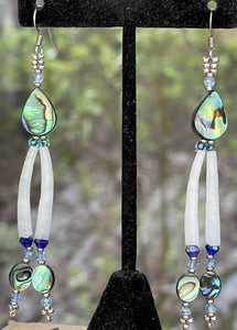 Dentalium earrings with teardrop and oval shaped Abalone, light blue crystals, Japanese size 8 beads and sterling silver beads. On hypoallergenic hooks.