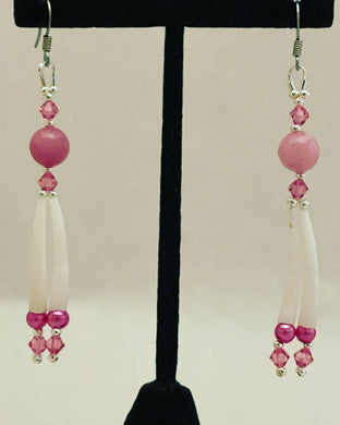 Rose Swarovski crystals with natural round stone bead, fuchsia pearls, sterling silver beads and Dentalium. On hypoallergenic hooks.