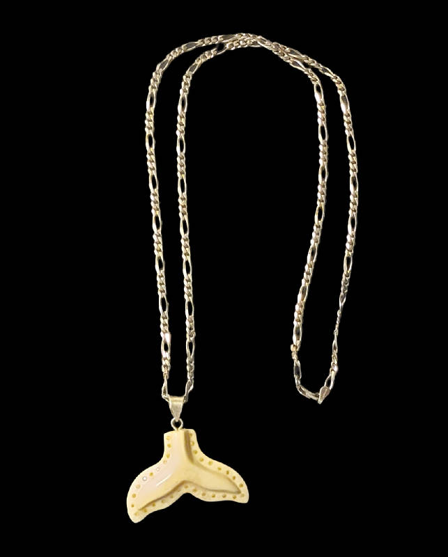 Ivory whale tail pendant with yellow diamonds